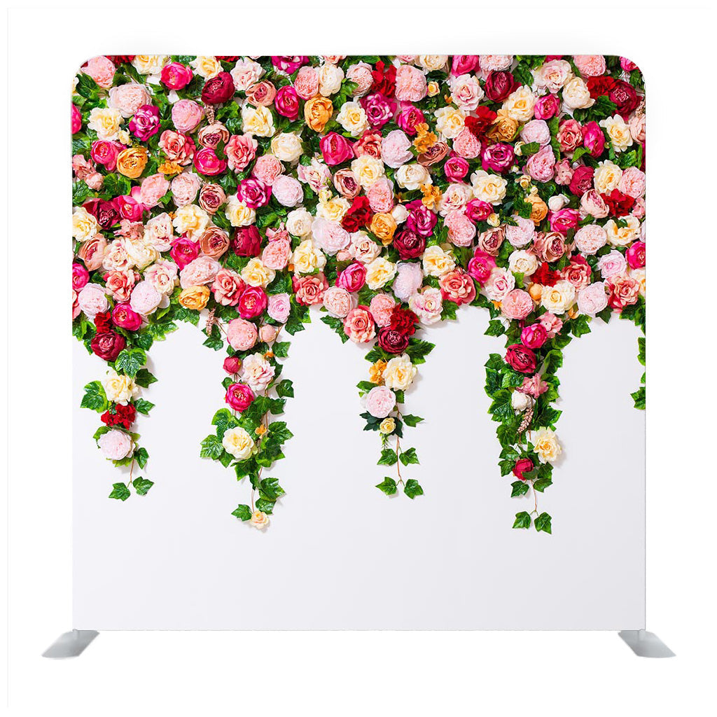 Close up of white wall with colorful flowers composition Backdrop